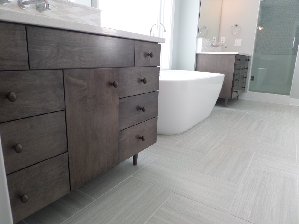 Custom vanities of my own design, with a dark grey driftwood finish.